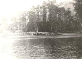 A section of the Grand Trunk Pacific Railway bed, with a low, log bridge under construction and with water in the foreground. (Images are provided for educational and research purposes only. Other use requires permission, please contact the Museum.) thumbnail