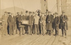 Group photo; presentation of a decorative tray, Prince Rupert, B.C.. (Images are provided for educational and research purposes only. Other use requires permission, please contact the Museum.) thumbnail