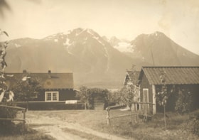 A house on the shores of Lake Kathlyn, with the Hudson's Bay Mountains in the background.. (Images are provided for educational and research purposes only. Other use requires permission, please contact the Museum.) thumbnail
