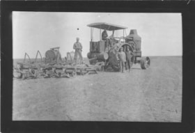 Men posing with steam tractor with a gang plough attached behind it. (Images are provided for educational and research purposes only. Other use requires permission, please contact the Museum.) thumbnail
