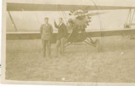 John DeVoin and [Wilmer Lewis] stand in front of a plane at the Smithers, B.C. airport. (Images are provided for educational and research purposes only. Other use requires permission, please contact the Museum.) thumbnail