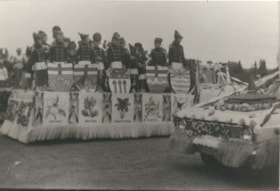Children on a parade float with shields from the Canadian Provinces.. (Images are provided for educational and research purposes only. Other use requires permission, please contact the Museum.) thumbnail