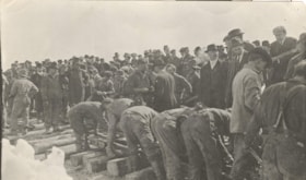 Crowd watching workers laying track at Fort Fraser, B.C.. (Images are provided for educational and research purposes only. Other use requires permission, please contact the Museum.) thumbnail