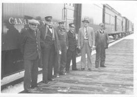 Group photo in front of Canadian National Railway car.. (Images are provided for educational and research purposes only. Other use requires permission, please contact the Museum.) thumbnail