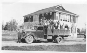 Group photo in truck outisde of the Smithers school.. (Images are provided for educational and research purposes only. Other use requires permission, please contact the Museum.) thumbnail