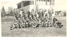 Boy's Hockey Team in front of Smithers High School. (Images are provided for educational and research purposes only. Other use requires permission, please contact the Museum.) thumbnail