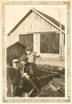 Family playing with a dog.. (Images are provided for educational and research purposes only. Other use requires permission, please contact the Museum.) thumbnail