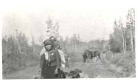 Unidentified Indigenous woman carrying a child on her back.. (Images are provided for educational and research purposes only. Other use requires permission, please contact the Museum.) thumbnail