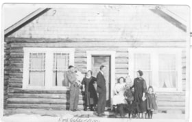 Jack Calderwood, holding Winnie (Hann), Mrs. and Mr. Anderson, Mrs. Calderwood, Wana and Addie Hann in front of the Calderwood's house.. (Images are provided for educational and research purposes only. Other use requires permission, please contact the Museum.) thumbnail