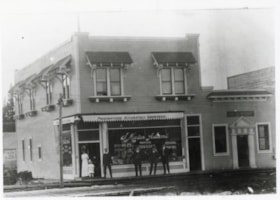 J. Mason Adams' Drugstore at the corner of Second Avenue and Main Street, Smithers, B.C.. (Images are provided for educational and research purposes only. Other use requires permission, please contact the Museum.) thumbnail