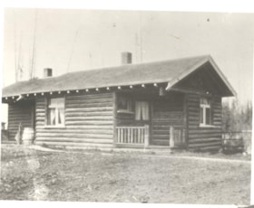 Log home on Broadway and Columbia, Smithers, B.C.. (Images are provided for educational and research purposes only. Other use requires permission, please contact the Museum.) thumbnail