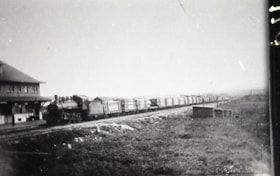 A G.T.P. train at the Smithers station, transporting logs.. (Images are provided for educational and research purposes only. Other use requires permission, please contact the Museum.) thumbnail