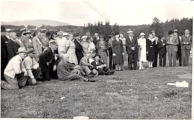 Group photo in a field. (Images are provided for educational and research purposes only. Other use requires permission, please contact the Museum.) thumbnail