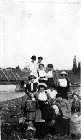 Group photo in front of the river.. (Images are provided for educational and research purposes only. Other use requires permission, please contact the Museum.) thumbnail