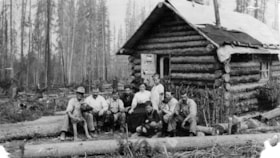 Group photo outside a cabin. (Images are provided for educational and research purposes only. Other use requires permission, please contact the Museum.) thumbnail