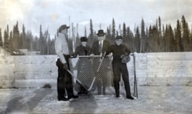 Group playing hockey posing by net. (Images are provided for educational and research purposes only. Other use requires permission, please contact the Museum.) thumbnail