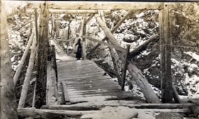 Mrs. O'Neill on the old Hagwilget Bridge, Hazelton, B.C.. (Images are provided for educational and research purposes only. Other use requires permission, please contact the Museum.) thumbnail