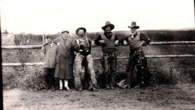 Mrs. Fisher with a boy and three cowboys at the Telkwa Barbecue.. (Images are provided for educational and research purposes only. Other use requires permission, please contact the Museum.) thumbnail