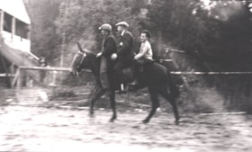 Three boys riding a mule in Telkwa.. (Images are provided for educational and research purposes only. Other use requires permission, please contact the Museum.) thumbnail