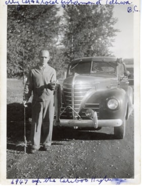 Local fisherman posing in front of vehicle, Telkwa, B.C.. (Images are provided for educational and research purposes only. Other use requires permission, please contact the Museum.) thumbnail