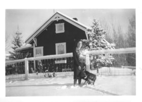 Florence Billeter with a dog in front of the Billeter farm house. (Images are provided for educational and research purposes only. Other use requires permission, please contact the Museum.) thumbnail