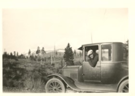 William Billeter peering out of his automobile. (Images are provided for educational and research purposes only. Other use requires permission, please contact the Museum.) thumbnail