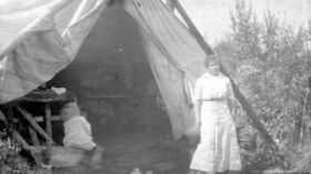 Martha Hanson and Linnea Hanson by a tent, Lake Kathlyn, B.C.. (Images are provided for educational and research purposes only. Other use requires permission, please contact the Museum.) thumbnail