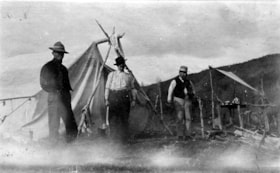 Three men standing in front of a tent. (Images are provided for educational and research purposes only. Other use requires permission, please contact the Museum.) thumbnail