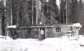 A cook standing at a cookhouse in a logging camp. (Images are provided for educational and research purposes only. Other use requires permission, please contact the Museum.) thumbnail