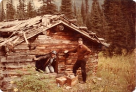 Jack Hetherington and a helicopter pilot at the 8th Yukon Telegraph Line cabin in the Muckakoo Pass. (Images are provided for educational and research purposes only. Other use requires permission, please contact the Museum.) thumbnail