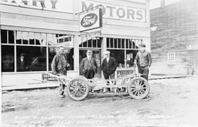 Slim Williams with Ford toboggan in front of Henry Motors. (Images are provided for educational and research purposes only. Other use requires permission, please contact the Museum.) thumbnail