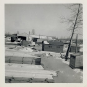 Buildings and stacks of wood at Northern Interior Forest Industries. (Images are provided for educational and research purposes only. Other use requires permission, please contact the Museum.) thumbnail