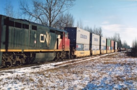 Cargo train passing by Smithers. (Images are provided for educational and research purposes only. Other use requires permission, please contact the Museum.) thumbnail
