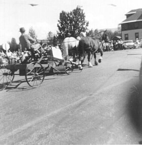 Angus McLean Sr. driving a horse team down Main Street in a parade. (Images are provided for educational and research purposes only. Other use requires permission, please contact the Museum.) thumbnail