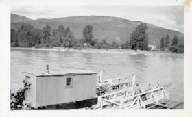 Loading a caboose onto a ferry, Kitwanga, B.C.. (Images are provided for educational and research purposes only. Other use requires permission, please contact the Museum.) thumbnail