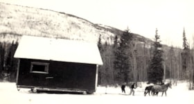 Jim Capling and Ernest Hann skidding a house across Seymour Lake. (Images are provided for educational and research purposes only. Other use requires permission, please contact the Museum.) thumbnail
