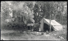 Four Witsuwit'en adults and a child posing by a tent. (Images are provided for educational and research purposes only. Other use requires permission, please contact the Museum.) thumbnail