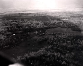 Aerial view of an unidentified farm in the Bulkley Valley. (Images are provided for educational and research purposes only. Other use requires permission, please contact the Museum.) thumbnail