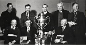 Curling Teams with trophies. (Images are provided for educational and research purposes only. Other use requires permission, please contact the Museum.) thumbnail