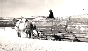 [Guy Farrell?] with sled load of railroad ties. (Images are provided for educational and research purposes only. Other use requires permission, please contact the Museum.) thumbnail