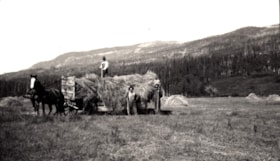 Men with hay wagon at Jack McNeil's Ranch, Telkwa, B.C.. (Images are provided for educational and research purposes only. Other use requires permission, please contact the Museum.) thumbnail