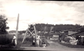 Five unidentified people at townsite. (Images are provided for educational and research purposes only. Other use requires permission, please contact the Museum.) thumbnail