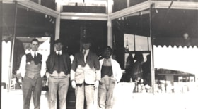 Four men in front of Broughton & McNeil store, Telkwa, B.C.. (Images are provided for educational and research purposes only. Other use requires permission, please contact the Museum.) thumbnail
