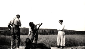 Three unidentified people with a deceased bear.. (Images are provided for educational and research purposes only. Other use requires permission, please contact the Museum.) thumbnail