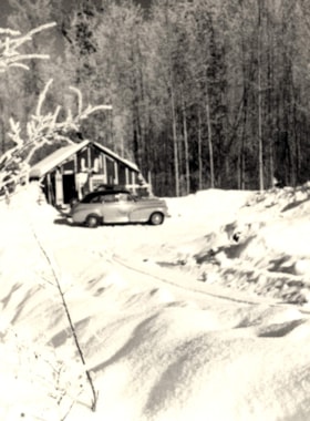 Car in front of winter cabin. (Images are provided for educational and research purposes only. Other use requires permission, please contact the Museum.) thumbnail