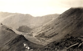 Red Rose Mine camp and surrounding mountains. (Images are provided for educational and research purposes only. Other use requires permission, please contact the Museum.) thumbnail