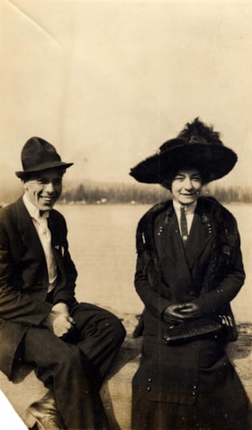 Fred Cassidy and Florrie Hann sitting on a log. (Images are provided for educational and research purposes only. Other use requires permission, please contact the Museum.) thumbnail
