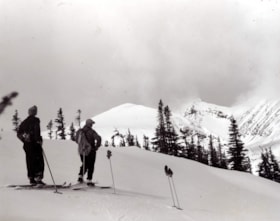 Jean Saffarek nee Anderson on the left and Tat Aida on the right on skis near Horseshoe Cabin.. (Images are provided for educational and research purposes only. Other use requires permission, please contact the Museum.) thumbnail