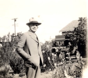 Mr. [Edwin E.?] Orchard in a garden. (Images are provided for educational and research purposes only. Other use requires permission, please contact the Museum.) thumbnail
