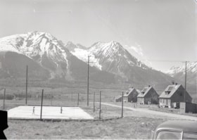 Houses to the right, mountains in the background.. (Images are provided for educational and research purposes only. Other use requires permission, please contact the Museum.) thumbnail